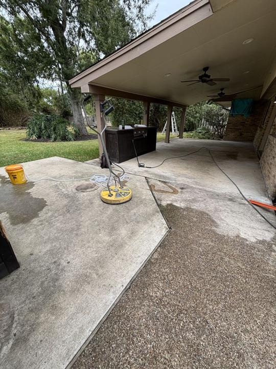 Covered patio concrete before cleaning