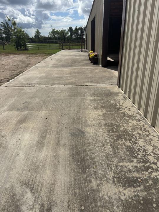 Barn walkway concrete before cleaning