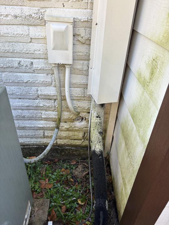 Electrical box and siding corner before cleaning