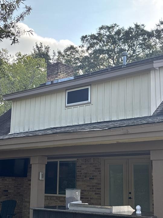 Board and batten dormer before cleaning
