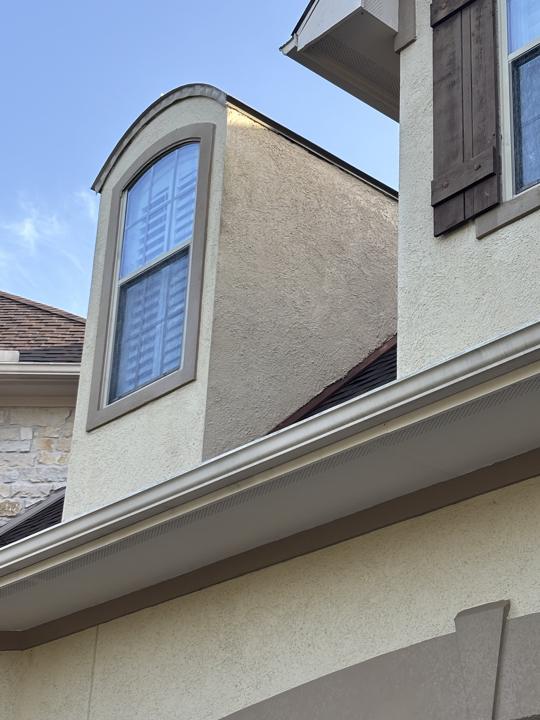 Stucco dormer after cleaning