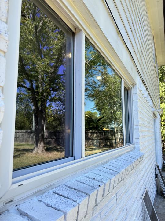 Window frames and brick sill after cleaning