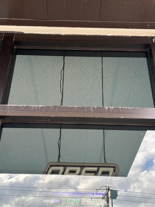 Storefront window before cleaning