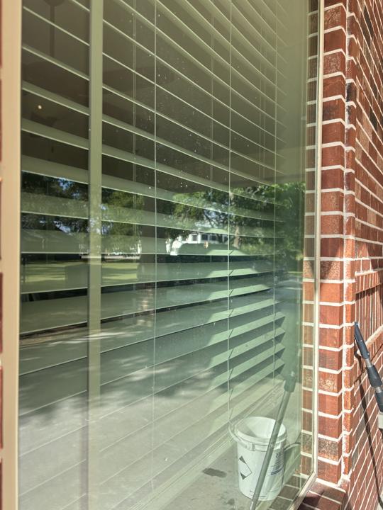 Window with blinds before cleaning